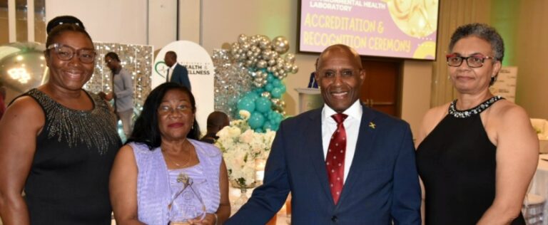 Minister of Industry, Investment and Commerce, Senator the Hon. Aubyn Hill (second right), is greeted by Technical Consultant with the Environmental Health Laboratory (EHL), Nilsia Johnson (second left), at the recent accreditation ceremony for EHL, held at the AC Mariott Hotel in New Kingston. Others pictured (from left) are Chief Executive Officer of the Jamaica National Agency for Accreditation (JANAAC), Dr. Yvette Castell, and Director of the National Public Health Laboratory (NPHL), Dr. Marlene Tapper.