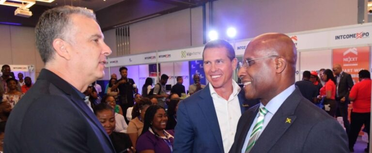 Minister of Industry, Investment and Commerce, Senator the Hon. Aubyn Hill (right) greets Managing Director of Intcomex Jamaica, Matthew DeLeon, at the recent opening ceremony of Intcomex Jamaica's Intcomexpo on April 3 at the AC Marriott Hotel in Kingston. Sharing the moment is Executive Chairman of Sandals Resorts International and Beaches Resorts, Adam Stewart.
