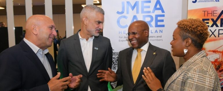 Minister of Industry, Investment and Commerce, Senator the Hon. Aubyn Hill (second right), is greeted by President and Chief Executive Officer, Sagicor Group Jamaica Limited, Christopher Zacca (left), during the Jamaica Manufacturers and Exporters Association (JMEA) Manufacture 360° Conference, at the AC Marriott Hotel in St. Andrew on May 29. Observing (from second left) are: President, Jamaica Manufacturers and Exporters Association (JMEA), Sydney Thwaites and Executive Director, JMEA, Kamesha Blake.