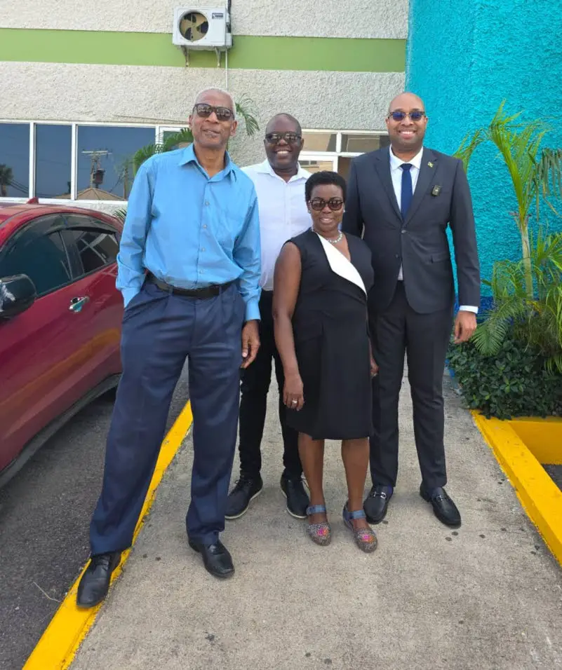 State minister in the Ministry of Industry, Investment and Commerce Delano Seiveright (right) shares lens time with (from left) Wayne Sinclair, Leezo Wallace and Gloria Henry, members of the board of the Global Services Association of Jamaica, in the Montego Bay Free Zone, last week.