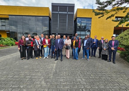 Senator the Hon. Aubyn Hill, Minister of Industry, Investment and Commerce (center), stands in front of DIANs office (Dirección de Impuestos y Aduanas Nacionales), the National Directorate of Taxes and Customs, with members of the Zona Franco de Bogota team and members of the Jamaican delegation in Bogota Colombia on February 25, 2026.