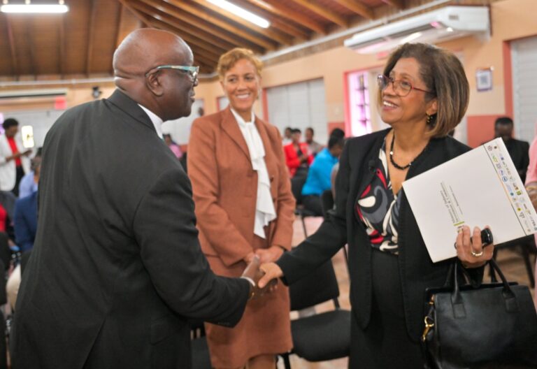 Permanent Secretary in the Ministry of Industry, Investment and Commerce, Sancia Bennett Templer (right), greets Executive Director of the Bureau of Standards Jamaica (BSJ), Dr. Velton Gooden, while Chair of the BSJ Standards Council, Jacqueline Millington, looks on. The exchange took place following the launch ceremony for the BSJ’s Information and Communications Technology (ICT) Accessibility Standards, held at the Bureau’s Multipurpose Facility in Kingston on Wednesday (February 25)