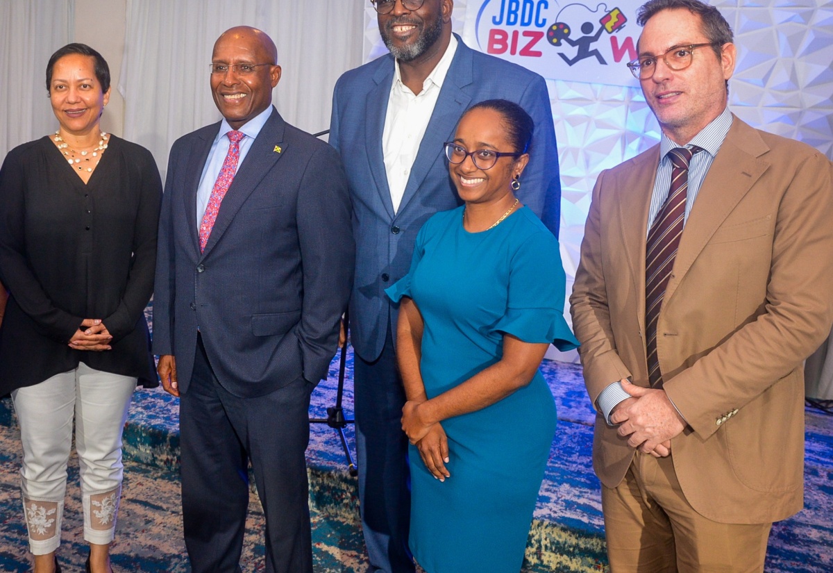 Photo: Minister of Industry, Investment and Commerce, Senator the Hon. Aubyn Hill (second left), pauses for a photo opportunity with (from left) Resident Representative of the Organization of American States (OAS), Jeanelle van GlaanenWeygel; Acting Chief Executive Officer of the Jamaica Business Development Corporation (JBDC), Harold Davis; President of Jamaica Promotions Corporation (JAMPRO), Shullette Cox; and Deputy Head of Cooperation at the European Union (EU) Delegation to Jamaica, Belize, The Bahamas, Turks and Caicos and the Cayman Islands, Koenraad Burie, following the launch of the JBDC Biz Wiz online learning platform at The Jamaica Pegasus hotel on March 5.