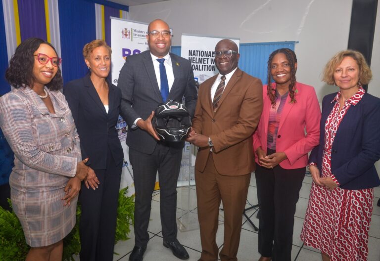 State Minister in the Ministry of Industry, Investment and Commerce, Hon. Delano Seiveright (third left), and Executive Director of the Bureau of Standards Jamaica (BSJ), Dr. Velton Gooden (fourth left), with (from left) Lead Youth and Education Programmes, Road Safety and Road User Education, Jamaica National Foundation, Sydoney Preddie; Chair of the Standards Council, BSJ, Jacqueline Millington; Chief Executive Officer of the CARICOM Regional Organization for Standards and Quality, Dr. Sharonmae Smith Walker; and Programme Director of the FIA Foundation, Agnieszka Krasnolucka. The event was the launch of the Bureau of Standards Jamaica (BSJ) Motorcycle Helmet standard - JS 374:2025 Jamaica Standard Specification – Protective Helmets for Road Users, on Tuesday (March 31) at the Jamaica Business Development Corporation (JBDC) Incubator and Resource Centre, in Kingston.