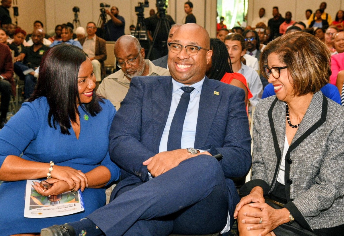 Minister of State in the Ministry of Industry, Investment and Commerce, Hon. Delano Seiveright, shares a light moment with Chief Executive Officer, Cannabis Licensing Authority (CLA), Farrah Blake (left), and Permanent Secretary in the Ministry, Sancia Bennett Templer, during the launch of CLA's Medical Cannabis Special Permit Programmes at the AC Hotel by Marriott Kingston on Thursday (April 16).