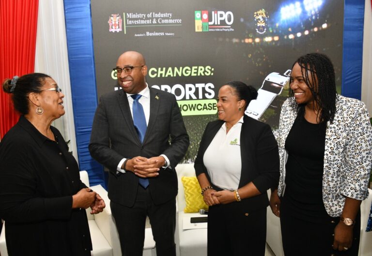 State Minister in the Ministry of Industry, Investment and Commerce, Hon. Delano Seiveright, converses with (from left) Jamaica Intellectual Property Office (JIPO) Executive Director, Lilyclaire Bellamy; Jamaica Anti-Doping Commission (JADCO) Chair, Debby-Ann Brown Salmon; and JIPO Deputy Director and Legal Counsel Shantal English Richards. The occasion was JIPO's Intellectual Property and Sports Symposium and Showcase, held recently at the University of Technology, Jamaica, in St. Andrew.