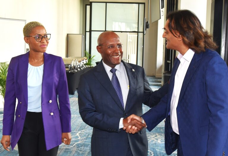 Minister of Industry, Investment and Commerce, Senator the Hon. Aubyn Hill (centre), greets Jamaica Special Economic Zone Authority (JSEZA) Chairman, Ambassador Dushyant Savadia (right), at the launch of the SEZ Facilitation Tool at the AC Marriott Hotel on Thursday (June 11). Sharing in the moment is Chief Executive Officer of JSEZA, Kelli-Dawn Hamilton. The digital platform is designed to enhance the ease of doing business with the country’s Special Economic Zone regime.