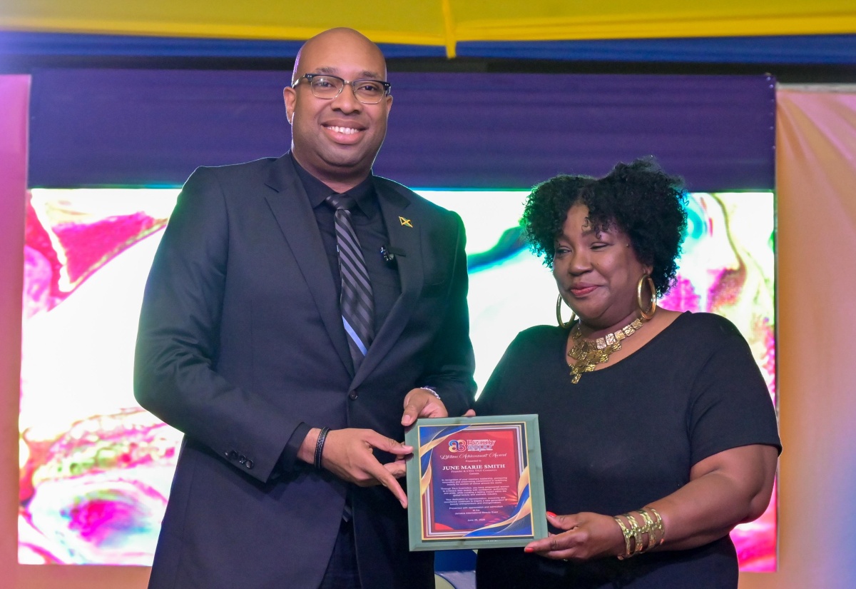 State Minister in the Ministry of Industry, Investment and Commerce Hon. Delano Seiveright, presents the Jamaica International Beauty Expo (JIBE) Lifetime Achievement Award to 2026 recipient, June Marie Smith, during Friday’s (June 26) JIBE opening ceremony at the National Arena in Kingston. Commerce Ministry Reaffirms Commitment to Business Formalisation Photo: Danielle Myers State Minister in the Ministry of Industry, Investment and Commerce Hon. Delano Seiveright, converses with Processor at Joy’s of Nature Cold Press Castor Oil, Carleen Howard, during Friday’s (June 26) Jamaica International Beauty Expo opening ceremony at the National Arena in Kingston. Commerce Ministry Reaffirms Commitment to Business Formalisation Photo: Danielle Myers Commerce Ministry Reaffirms Commitment to Business Formalisation Photo: Danielle Myers State Minister in the Ministry of Industry, Investment and Commerce Hon. Delano Seiveright, delivers the keynote address during Friday’s (June 26) Jamaica International Beauty Expo opening ceremony at the National Arena in Kingston. Commerce Ministry Reaffirms Commitment to Business Formalisation Photo: Danielle Myers Models showcase wearable art created by T&T Fashion, during a fashion show at the Jamaica International Beauty Expo opening ceremony at the National Arena in Kingston on Friday (June 27). Commerce Ministry Reaffirms Commitment to Business Formalisation Photo: Danielle Myers Head of the School of Cosmetology at Excelsior Community College, Alia Wedderburn (left), presents the award for best booth to Chief Executive Officer of Ettenio, Antoinette Palmer, during Friday’s (June 26) Jamaica International Beauty Expo opening ceremony at the National Arena in Kingston. Commerce Ministry Reaffirms Commitment to Business Formalisation Photo: Danielle Myers