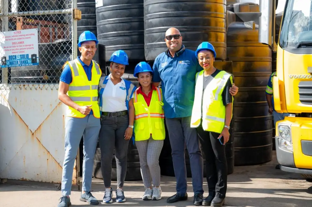Minister of state in the Ministry of Industry, Investment and Commerce Delano Seiveright (second right), and Jamaica Business Development Corporation CEO Daenia Ashpole (right) share a moment with the Rock Solid Plastics team of (from left) Managing Director Andrew Simpson, Anique Simpson, and Ashley Nesbeth during a tour of the company’s manufacturing facility on Ashenheim Road in St Andrew on Tuesday.